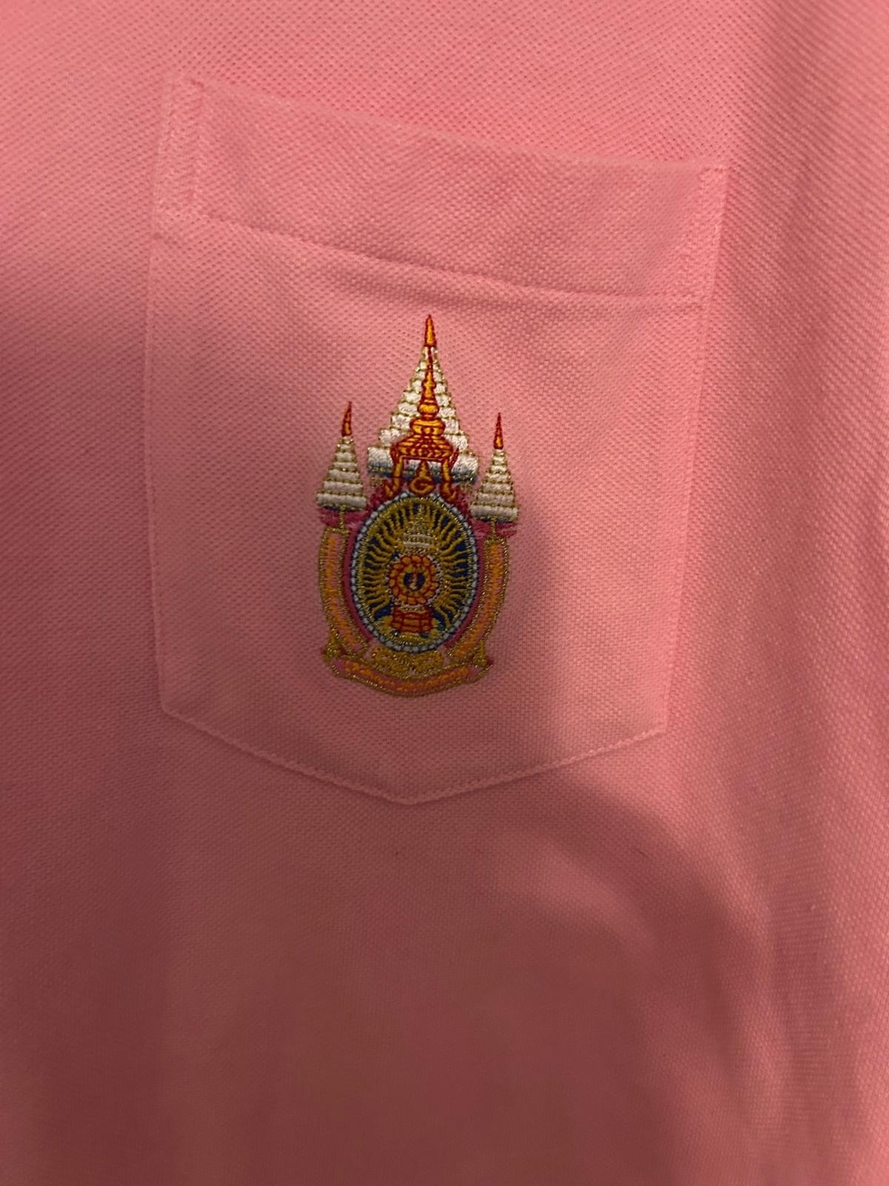 pink, short-sleeve polo shirt that may be associated with Justin Bieber's tour View 4